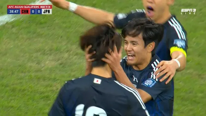 Japanese players celebrate first goal against China- Sportz Point.com