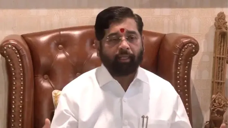 Maharashtra Chief Minister Eknath Shinde talking to reporters at his residence in Thane
