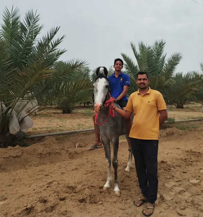 mukesh manjoo farmer with his son