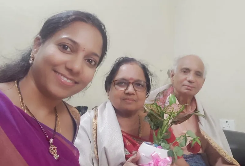 Sowmya with her parents.