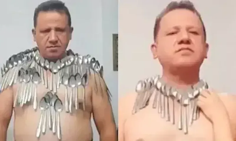 An Iranian man sets a new Guinness World Record by balancing 85 spoons on his torso