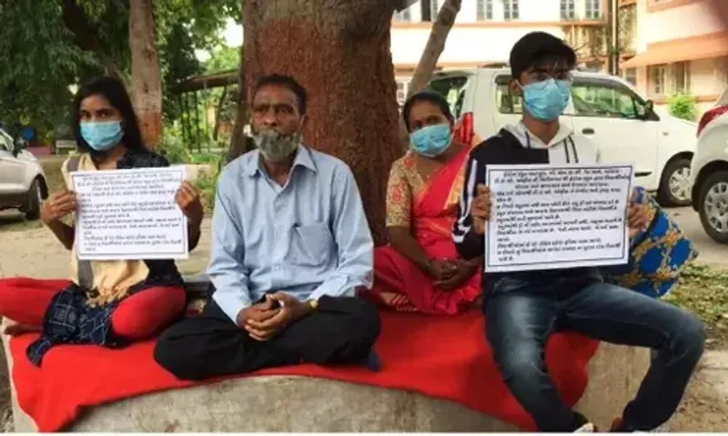 Student with family sit on fast outside Vadodara DEO office