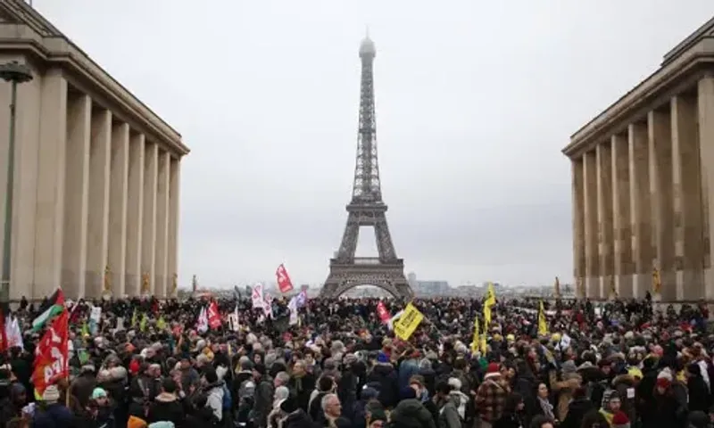 Thousands of protesters march against France's immigration bill