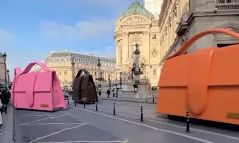 Giant Jacquemus handbags zip through the streets of Paris