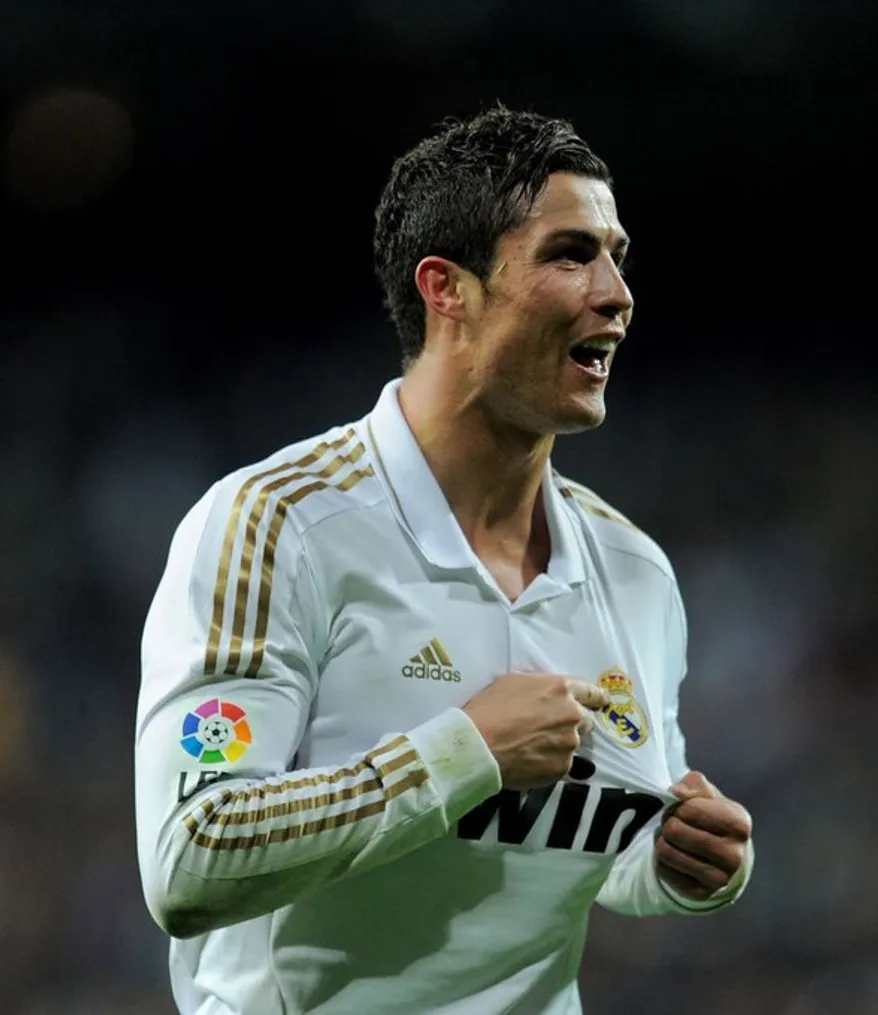 Cristiano Ronaldo pointing at the Madrid Crest- Sportz Point.com