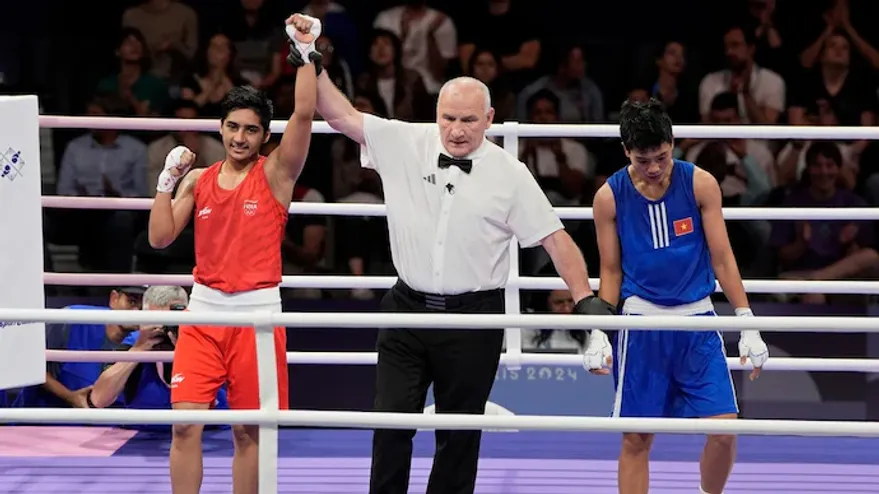 Preeti Pawar wins her first bout with a win over Vo Thi Kim Anh of Vietnam by unanimous decision in the round of 32 in the women's 54kg boxing event. -sportzpoint.com