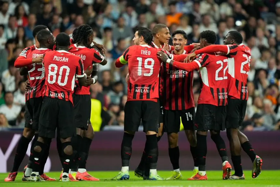Milan players celebrate a resounding win over real madrid- Sportz Point.com