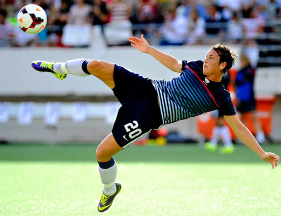 American soccer Legend Abby doing an overhead kick- Sportz Point.com