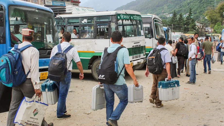 Polling officials leave for their respective polling booths after collecting election material from a distribution center ahead of the last phase of Lok Sabha polls, in Kullu, Thursday, May 30, 2024