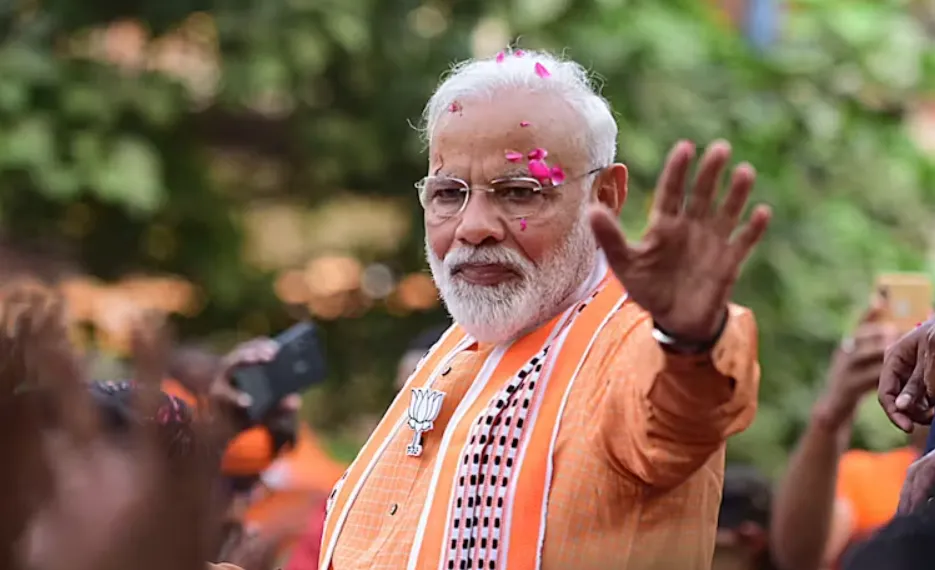 Prime Minister Narendra Modi waves to his supporters during a road show in Varanasi, Uttar Pradesh, after the BJP’s election victory in 2019. Prabhat Kumar Verma/EPA
