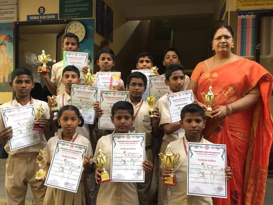 bridges founder with students