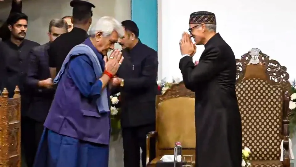 Jammu and Kashmir Lieutenant Governor Manoj Sinha being greeted by CM-designate Omar Abdullah before the latter's swearing-in ceremony, in Srinagar, Wednesday, Oct 16, 2024.