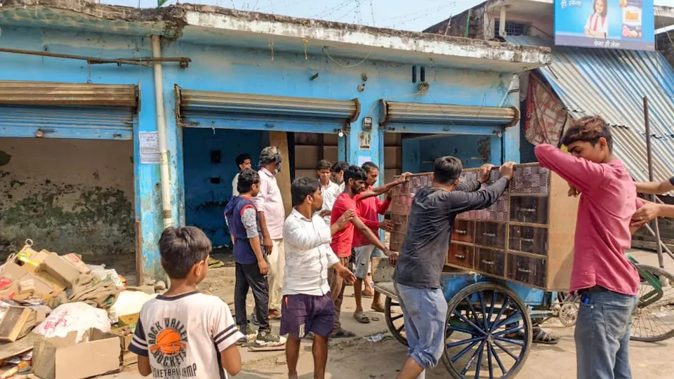 Locals vacate their shops after public works department (PWD) pasted notices on the properties, in violence-hit Maharajganj area of Bahraich, UP, Saturday, Oct 19, 2024.