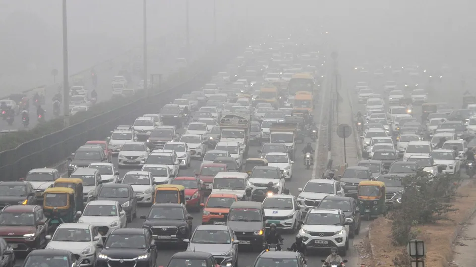 Vehicles move on the Delhi-Gurugram expressway amid low visibility due to fog