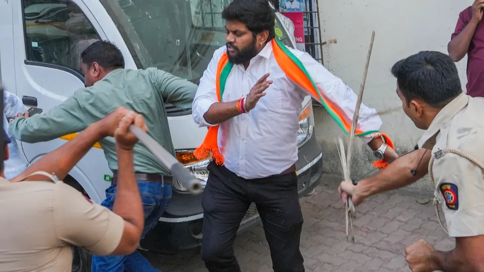 Police personnel lathi-charge to disperse agitators during a protest by Bharatiya Janata Yuva Morcha members outside Congress office in Mumbai on Thursday, Dec. 19, 2024.