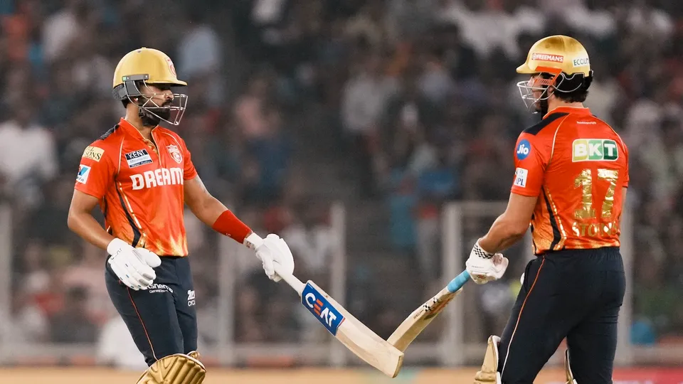 Punjab Kings' batter Shreyas Iyer celebrates with teammate Marcus Stoinis after his half century during the Indian Premier League (IPL) 2025 match between Gujarat Titans and Punjab Kings, at Narendra Modi Stadium in Ahmedabad on Tuesday, March 25, 2025.