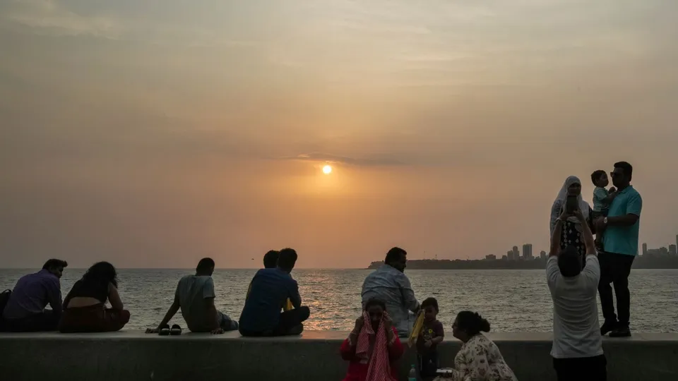 Visitors at the Marine Drive, in Mumbai, Friday, June 7, 2024.