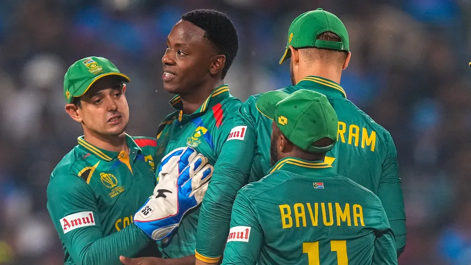 South African bowler Kagiso Rabada celebrates with teammates the wicket of New Zealand batter Tom Latham during the ICC Men's Cricket World Cup 2023 match between New Zealand and South Africa, at Maharashtra Cricket Association Stadium, in Pune, Wednesday, Nov. 1, 2023.