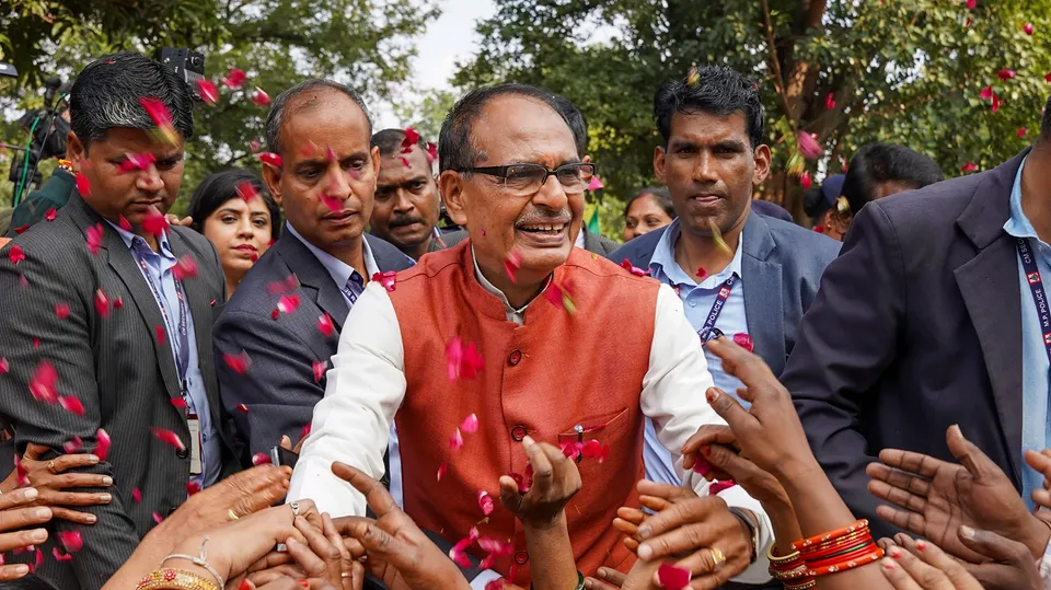 Madhya Pradesh Chief Minister Shivraj Singh Chouhan with BJP workers and supporters celebrates the party's lead during counting of votes for MP Assembly elections