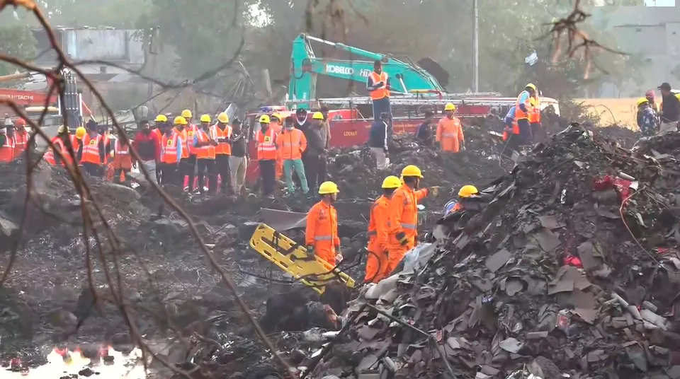 Rescue officials at the site of the firecrackers factory