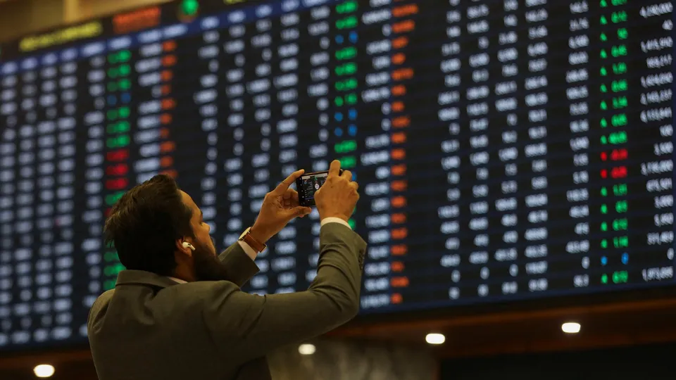 electronic board displaying share prices during a trading session at the Pakistan Stock Exchange, in Karachi, Pakistan