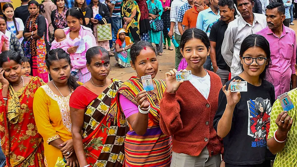 Voters wait in queues at a polling station during the 3rd phase of Lok Sabha polls, in Guwahati, Tuesday, May 7, 2024