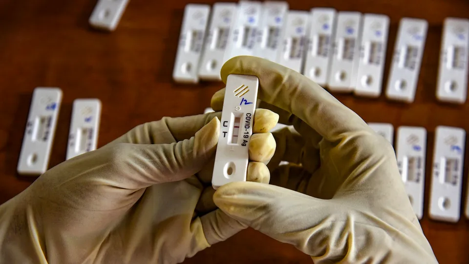 A healthcare worker conducts Covid-19 test, amid a rise in coronavirus cases in the country, in Hyderabad