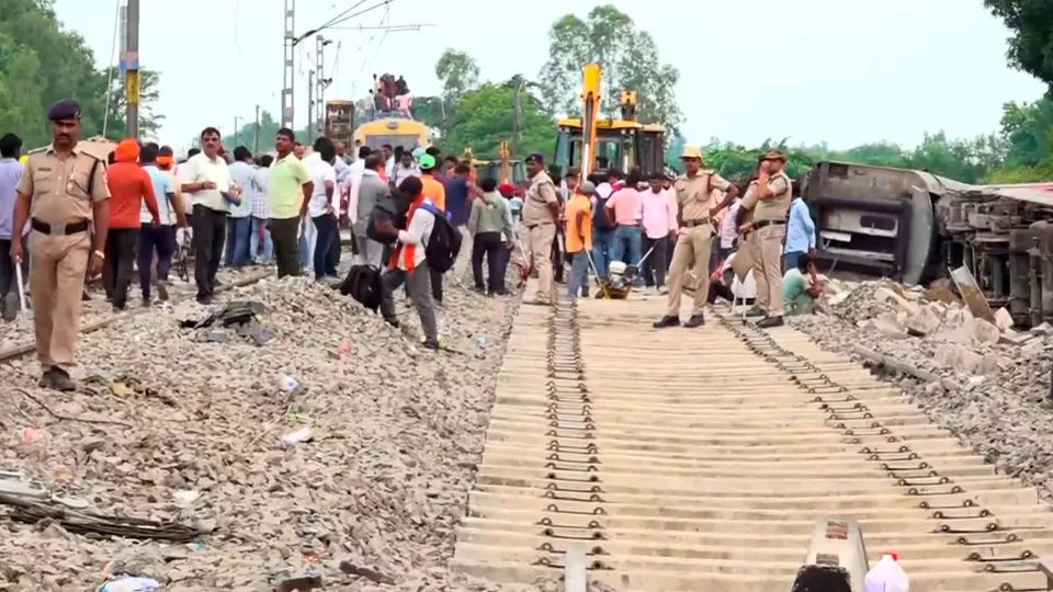 Police personnel and railways workers during restoration work after eight coaches of the Chandigarh-Dibrugarh Express derailed on Thursday, in Gonda district, Friday, July 19, 2024.