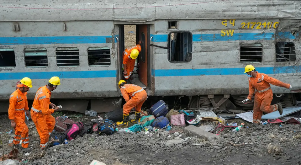 NDRF personnel during the restoration work at the site of Friday's triple train accident near Bahanaga Bazar railway station, in Balasore district