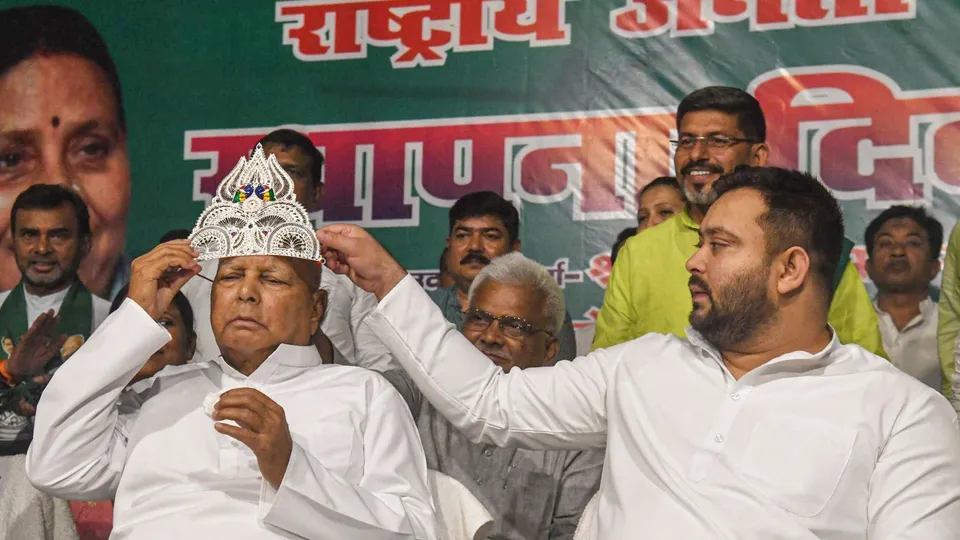 RJD chief Lalu Prasad wears a sliver crown during the party's 28th Foundation Day function at the party office, in Patna, Friday, July 5, 2024.