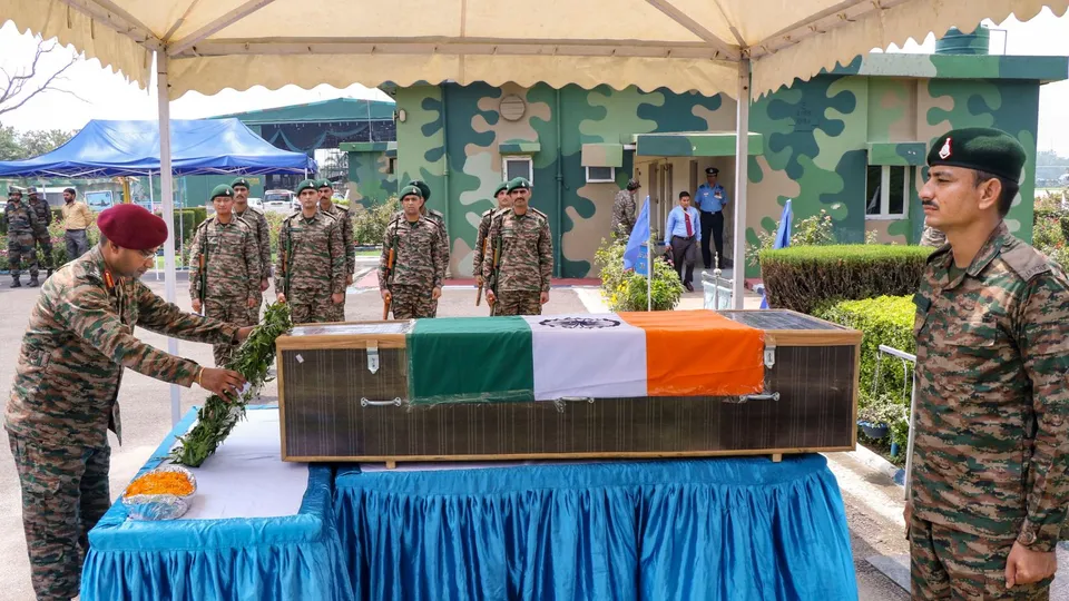 An army personnel pays tribute to the mortal remains of Lance Naik Subash Kumar, in J&K's Poonch district, in Jammu, Wednesday, July 24, 2024.