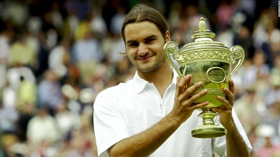 Roger Federer with his first major grand slam title - Wimbledon 2003 (File photo)