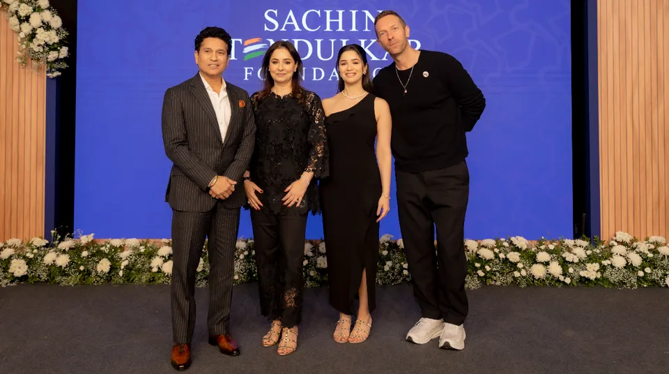 Sachin,Anjali,Sara with Chris Martin at 5 year clebration of Sachin Tendulkar Foundation.JPG