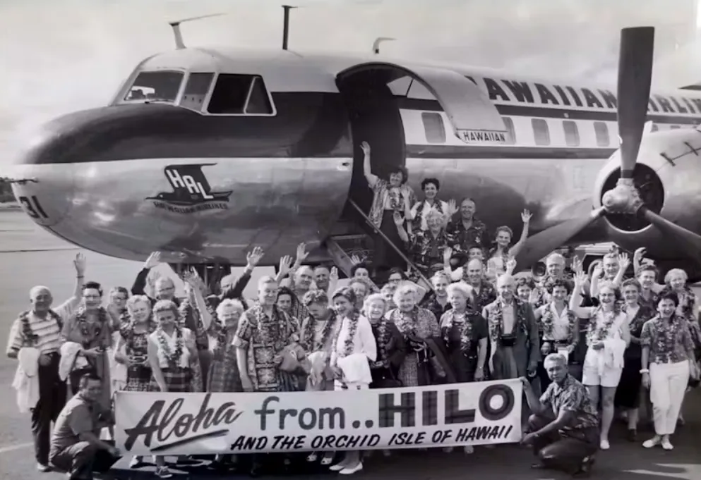 An avid traveler, Pearl Young – waving at the top of the stairs – traveled to Hawaii on a UND alumni trip in 1960. Pearl Young Papers collection in UND's Special Collections